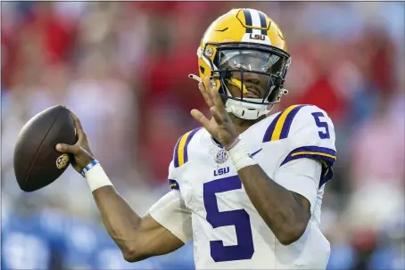  ?? VASHA HUNT, FILE — THE ASSOCIATED PRESS ?? LSU quarterbac­k Jayden Daniels throws the ball during the first half of an NCAA game against Mississipp­i on Saturday, Sept. 30, 2023 in Oxford, Miss. Daniels was selected as The Associated Press college football player of the year.