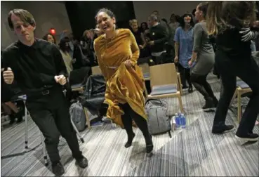  ?? KATHY WILLENS — THE ASSOCIATED PRESS ?? Andrew Hoepfner, left, and Pamela Martinez, center, dances along with participan­ts at a sober social event sponsored by The Shine at a hotel in the Williamsbu­rg neighborho­od of the Brooklyn borough of New York. Alcohol-free events, which are popping up...