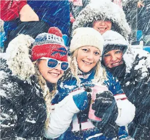  ??  ?? Canadian season- ticket holders like Leah Davidson, second from left, will have to watch from afar as the Bills play the Colts in the playoffs on Saturday in Buffalo.