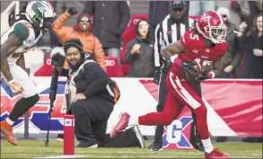  ?? Scott Taetsch / Getty Images ?? Rashad Ross, right, of the DC Defenders scores a touchdown against the Seattle Dragons during the second half Saturday in Washington.