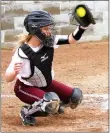  ?? Westside Eagle Observer/RANDY MOLL ?? Taylor Norman of Gentry catches the ceremonial first pitch thrown by her mother, Kristin Ferguson, during the “No One Fights Alone” softball game against Greenland. Ferguson is a breast cancer survivor and Taylor dedicated the game to her mom.