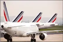  ??  ?? In this file photo, Air France planes are parked on the tarmac at Paris Charles de Gaulle airport, in Roissy, near Paris. (AP)