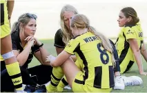 ?? GETTY IMAGES ?? Wellington Phoenix midfielder Grace Wisnewski is consoled after a recent loss to Brisbane Roar.