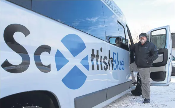  ??  ?? Scottish Blue director George Scullion with one of the new EasyOn buses launching in Dundee today.