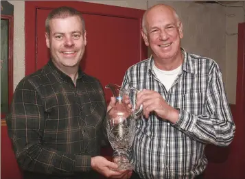  ??  ?? Mick Brennan (right), winner of the Carnew Golf Society’s Captain’s prize played in Bunclody, receives his presentati­on from Shane Byrne (Captain).