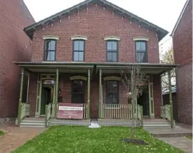  ?? Nate Guidry/Post-Gazette ?? The exterior of the duplex at 1403-1405 Pennsylvan­ia Ave. on the North Side has restored and new architectu­ral trim.