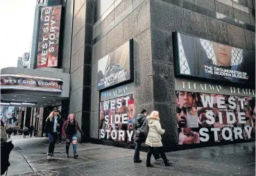  ?? /AFP ?? Bedside story: A poster outside the Broadway Theatre advertises ‘West Side Story’ in New York on February 7. The city's celebrated Broadway theatres have been shuttered since March 12 and may well not reopen before September. The very real fear is that with no public funding to help them weather the crisis, some theatres may never reopen.