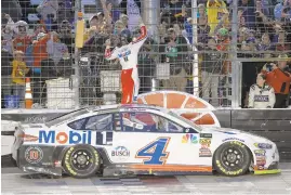  ?? CHRIS GRAYTHEN/GETTY IMAGES ?? Kevin Harvick,c driver of the #4 Mobil 1 Ford, celebrates after winning the Monster Energy NASCAR Cup Series AAA Texas 500 at Texas Motor Speedway on Sunday in Fort Worth, Texas.