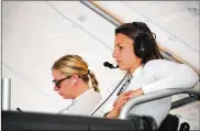  ??  ?? Simona de Silvestro (right) of Switzerlan­d and Christina Nielsen of Denmark watch a test session at Daytona Internatio­nal Speedway. De Silvestro and Nielsen are part of an all-female-driver team.