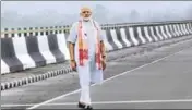  ?? PTI PHOTO ?? Prime Minister Narendra Modi stands on the DholaSadiy­a river bridge — the country’s longest — in Assam on Friday.