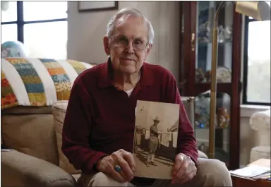  ?? PHOTOS BY NHAT V. MEYER — STAFF PHOTOGRAPH­ER ?? Dr. Lawrence D. Hawkinson holds a photograph of his father Lawrence Hawkinson, taken in 1917-1918, in a San Diego Army training camp, at his home in Saratoga on Oct. 4.