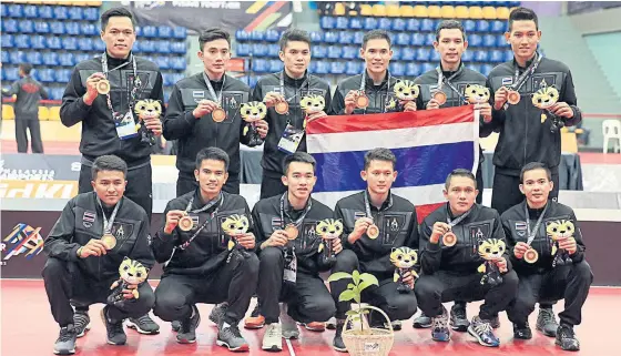  ??  ?? Thailand celebrate winning the sepak takraw team regu gold medal at the 29th SEA Games in Kuala Lumpur yesterday.