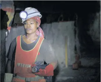  ??  ?? A female mine worker undergroun­d at Lonmin’s Karee mine in Rustenburg, northwest of Johannesbu­rg. The majority of women in mining are “general workers” as opposed to holding managerial and profession­al positions.