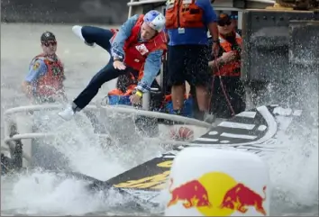  ?? Haley Nelson/Post-Gazette ?? Walt Czekaj braces for impact on his skateboard-inspired flying device at the Red Bull Flugtag on the North Shore during the 2017 EQT Pittsburgh Three Rivers Regatta. KDKA-TV’s Dave Crawley claims he was injured during his stunt on the Flugtag that year.