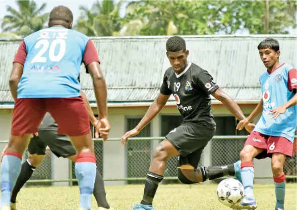  ?? Fiji Football Associatio­n Media ?? Ba defender Mitieli Naiviro defends against Nasinu during the Vodafone Premier League.
Photo: