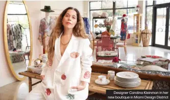  ?? ?? Designer Carolina Kleinman in her new boutique in Miami Design District