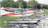  ?? JERRY FALLSTROM/STAFF ?? Seaplanes from Jones Brothers Air &amp; Seaplane Adventures in Tavares are tied at the shore of Lake Dora on Saturday.