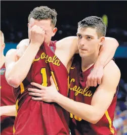  ?? DAVID J. PHILLIP/ASSOCIATED PRESS ?? Loyola-Chicago’s Ben Richardson is comforted by Clayton Custer, right, after their loss in the semifinals of the NCAA Tournament’s Final Four. It was the Ramblers’ first NCAA appearance since 1985.