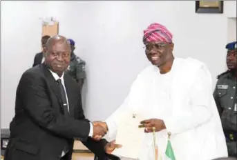  ??  ?? The newly appointed Acting Chief Judge of Lagos State, Hon. Justice Kazeem Alogba being congratula­ted by Lagos Sttae Governor, Babajide Sanwo-Olu after being sworn-in, last Thursday
