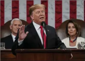  ?? DOUG MILLS — THE NEW YORK TIMES VIA AP ?? President Donald Trump gives his State of the Union address to a joint session of Congress, Tuesday at the Capitol in Washington, as Vice President Mike Pence, left, and House Speaker Nancy Pelosi look on.