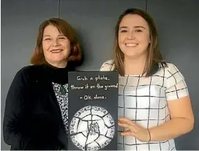  ??  ?? Margaret Little and Samara Welch hold the artwork produced by a survivor of domestic violence that inspired the name of the exhibition ‘Joining the Pieces.’