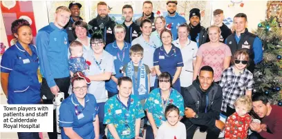  ??  ?? Town players with patients and staff at Calderdale Royal Hospital