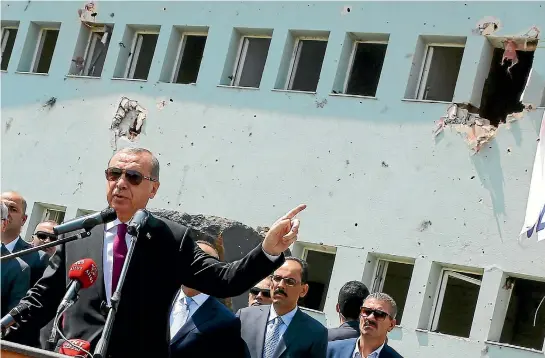  ?? PHOTO: REUTERS ?? Turkey’s President Recep Tayyip Erdogan addresses an audience during a visit at the weekend to a Turkish police special forces base damaged by fighting during the coup attempt. He is continuing to implement a hard line in response to the military action a fortnight ago attempting to topple him.