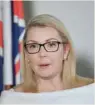  ?? — Reuters ?? Skye Kakoschke-Moore announces her resignatio­n at her office in Adelaide on Wednesday.