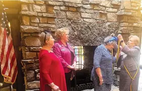  ?? N Submitted photo ?? Col. John Washington Chapter President Judy Robbins and Pat McLemore, newly elected state president, witness the sashing.