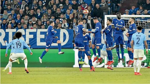  ?? AP ?? Manchester City winger Leroy Sane, left, curls in a brilliant freekick for his team’s second goal in their 3-2 win over Schalke.