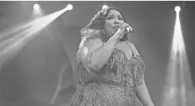  ?? JUNFU HAN, DETROIT FREE PRESS ?? Lizzo performs at the River Stage of Mo Pop Festival at West Riverfront Park in Detroit, Saturday, July 27, 2019.