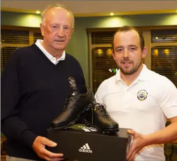  ??  ?? New Ross Vice-Captain Bill Hurley with Paddy Delaney, winner of the singles competitio­n sponsored by Stafford’s Fuels.