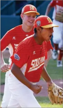  ?? GENE J. PUSKAR — THE ASSOCIATED PRESS ?? Texas’ Mark Requena, right, and Chip Buchanan celebrate getting the final out of a 6-5 win over North Carolina in the United States Championsh­ip game at the Little League World Series in South Williamspo­rt on Saturday.