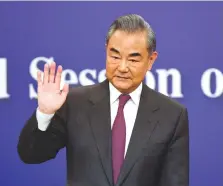  ?? (Tingshu Wang/Reuters) ?? CHINESE FOREIGN MINISTER Wang Yi waves at the end of a press conference on the sidelines of the National People’s Congress (NPC), in Beijing yesterday.