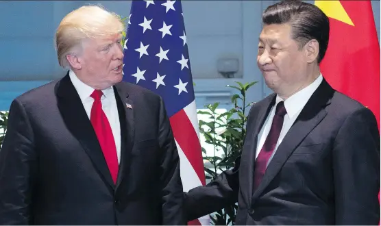  ?? SAUL LOEB / THE ASSOCIATED PRESS FILE PHOTO ?? U.S. President Donald Trump, left, and China’s President Xi Jinping at a meeting on the sidelines of the G-20 Summit in Hamburg, Germany, last summer. There’s little doubt the tax on anything Chinese would inflate prices for U.S. consumers and make...