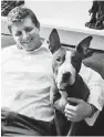  ?? GUARD/AP
ILLINOIS NATIONAL ?? Guardsman Spc. Jacob Montgomery cuddles with Dexter at the home of a friend near Peoria, Ill.