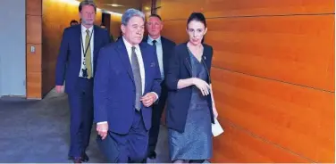  ?? Agence France-presse ?? ↑ Jacinda Ardern (right) arrives for a press conference in Wellington on Monday.