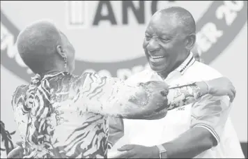  ?? REUTERS/Siphiwe Sibeko ?? Deputy president of South Africa Cyril Ramaphosa greets an ANC member during the 54th National Conference of the ruling African National Congress (ANC) at the Nasrec Expo Centre in Johannesbu­rg, South Africa December 18, 2017.