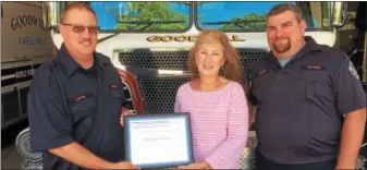  ?? EVAN BRANDT — DIGITAL FIRST MEDIA ?? From left, Rusty Layre, a career firefighte­r for Good Will Fire Company; Janice K. Clare, an engineerin­g specialist with FM Global insurance; and Kevin Yerger, chief of Good Will Fire Company, hold the recent fire prevention grant award.