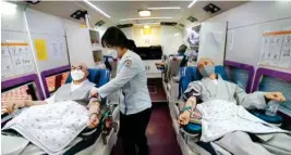  ?? PTI ?? Buddhist monks wearing face masks donate blood due to the shortage of blood donators amid the rapid spread of the new Coronaviru­s at the Jogyesa temple in Seoul, Tuesday