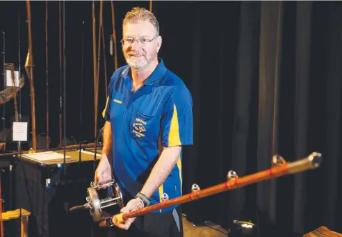  ?? Picture: STEWART McLEAN ?? HOOKED: Brendan Moore shows a game fishing rod at the Australian National Sportfishi­ng Associatio­n public expo. JANESSA EKERT