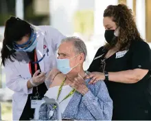  ?? MATIAS J. OCNER mocner@miamiheral­d.com ?? Antonio Castro receives the Pfizer-BioNTech COVID-19 vaccine from Erika Blanco at an assisted-living facility in Kendall on Wednesday.