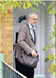  ??  ?? Mr Corbyn leaves home for his big day, which started at Caterpilla­rs Pre-School