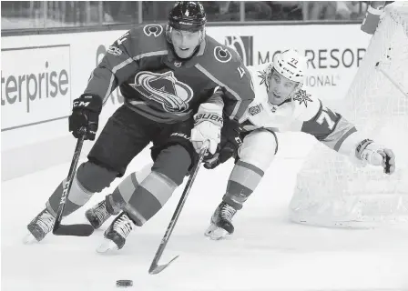  ??  ?? Avs defenceman and Langford product Tyson Barrie tries to fend off Knights defenceman Brad Hunt on Friday.