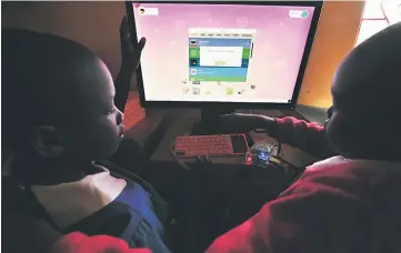  ??  ?? Pupils of Kibera School for Girls learn how to use computers in Nairobi. Android has just overtaken Windows as the world’s most-used operating system. — AFP photo