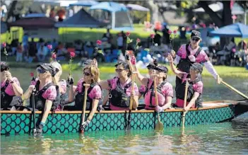  ?? Mariah Tauger For The Times ?? THE L.A. PINK DRAGONS honor breast cancer survivors at the L.A. Dragon Boat Festival last month.