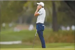  ?? AP photo ?? Collin Morikawa reacts after missing a putt for birdie on the 11th hole during the second round of the Players Championsh­ip Friday.