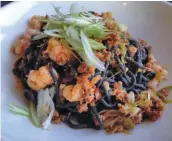  ??  ?? Black spaghetti, hot calabrese sausage, red shrimp, scallions (Courtesy photo)