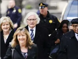  ?? COREY PERRINE/The Associated Press ?? Tom Mesereau, center, lawyer for actor and comedian Bill Cosby, arrives with the defense team for Cosby’s jury selection at the Montgomery County Courthouse, Thursday in Norristown, Pa. The long-awaited retrial is scheduled to begin today.