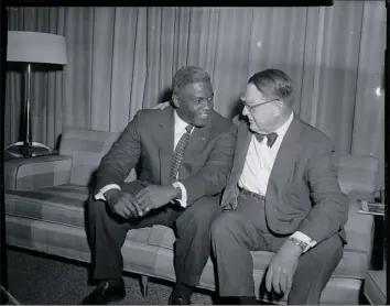  ?? @ Carnegie Museum of Art, Charles “Teenie” Harris Archive ?? Jackie Robinson, left, and baseball executive Branch Rickey, who asked Mr. Robinson to play for the Brooklyn Dodgers. The two men reunited in Pittsburgh in 1957, a decade after Mr. Robinson broke baseball’s color barrier.